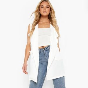 White textured tie waist sleeveless blazer